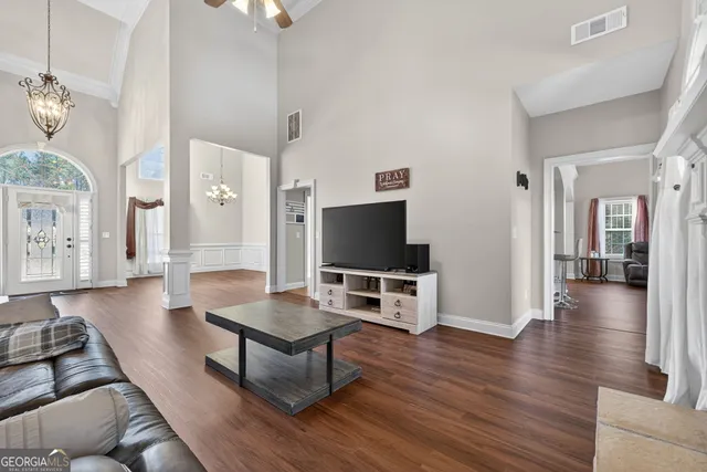 a living room with furniture and a fireplace