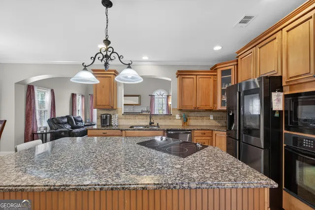 a aerial view of a house with yard swimming pool and outdoor seating