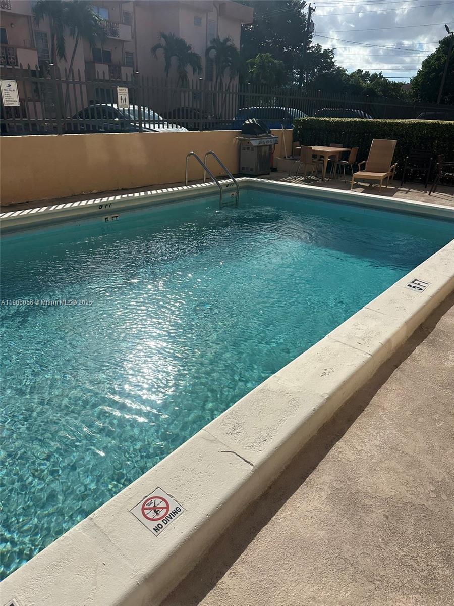 5280 Northwest 7th Street, Unit 306 Miami, FL 33126 - Photo 22 of 23 a view of outdoor space with garden