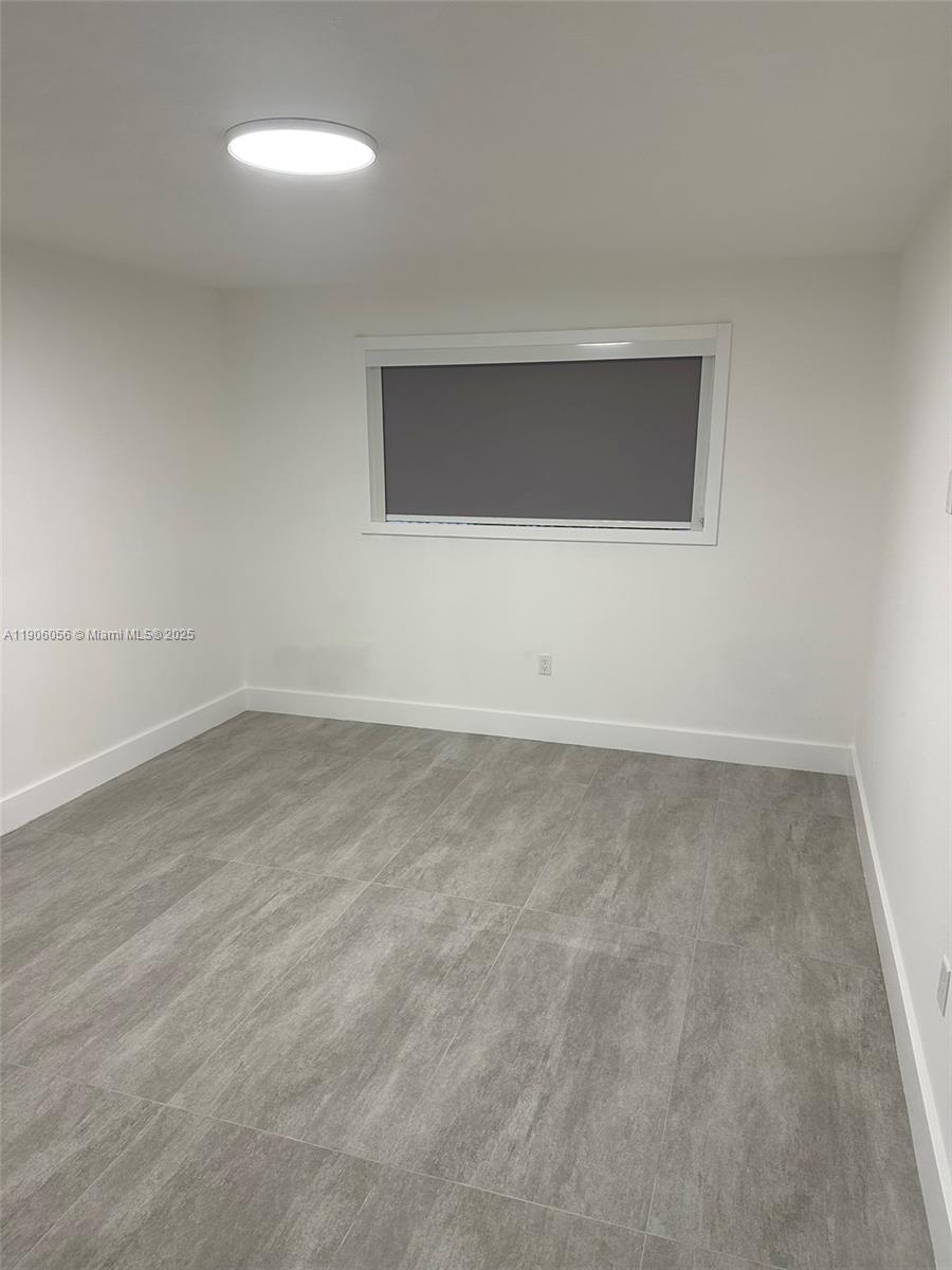 5280 Northwest 7th Street, Unit 306 Miami, FL 33126 - Photo 7 of 23 a view of empty room