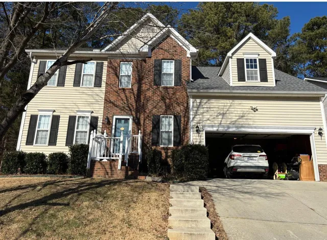 a front view of a house with parking