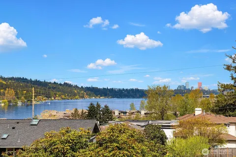 a view of a lake with houses in the back