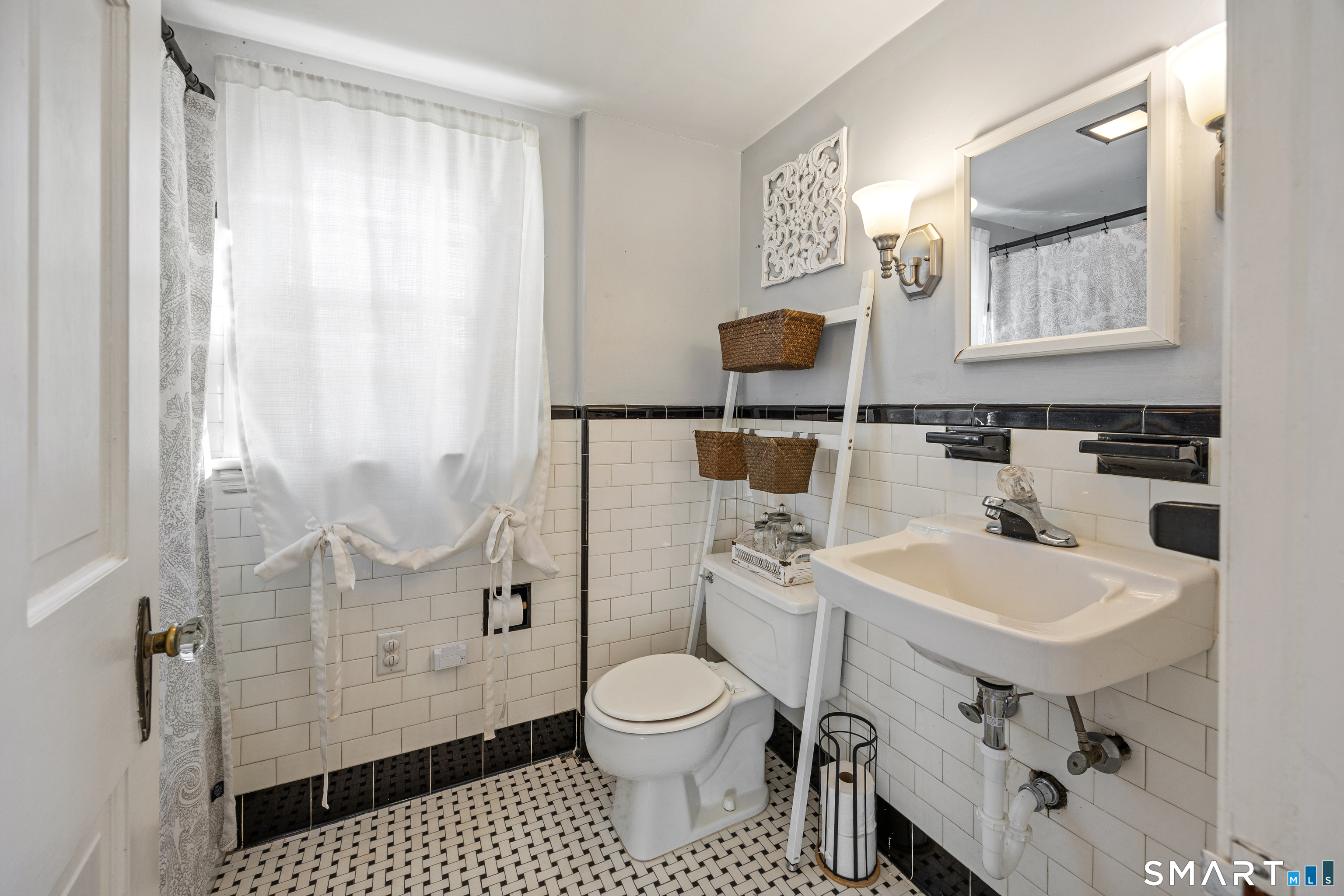 232 High Street Thomaston, CT 06787 - Photo 15 of 31 a bathroom with a sink toilet a mirror and shower