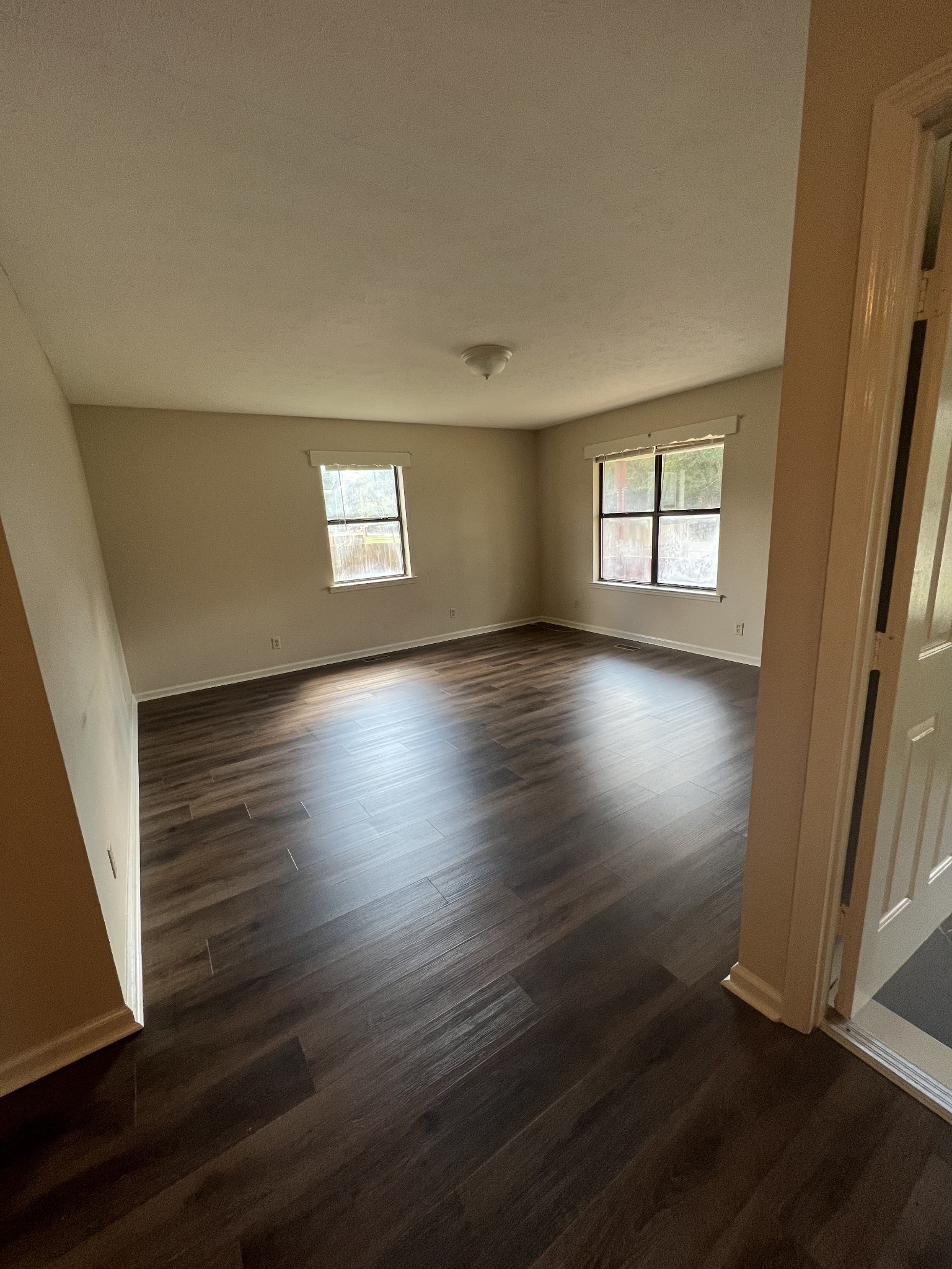 5012 Jacksboro Road Morrison, TN 37357 - Photo 5 of 13 an empty room with wooden floor and windows