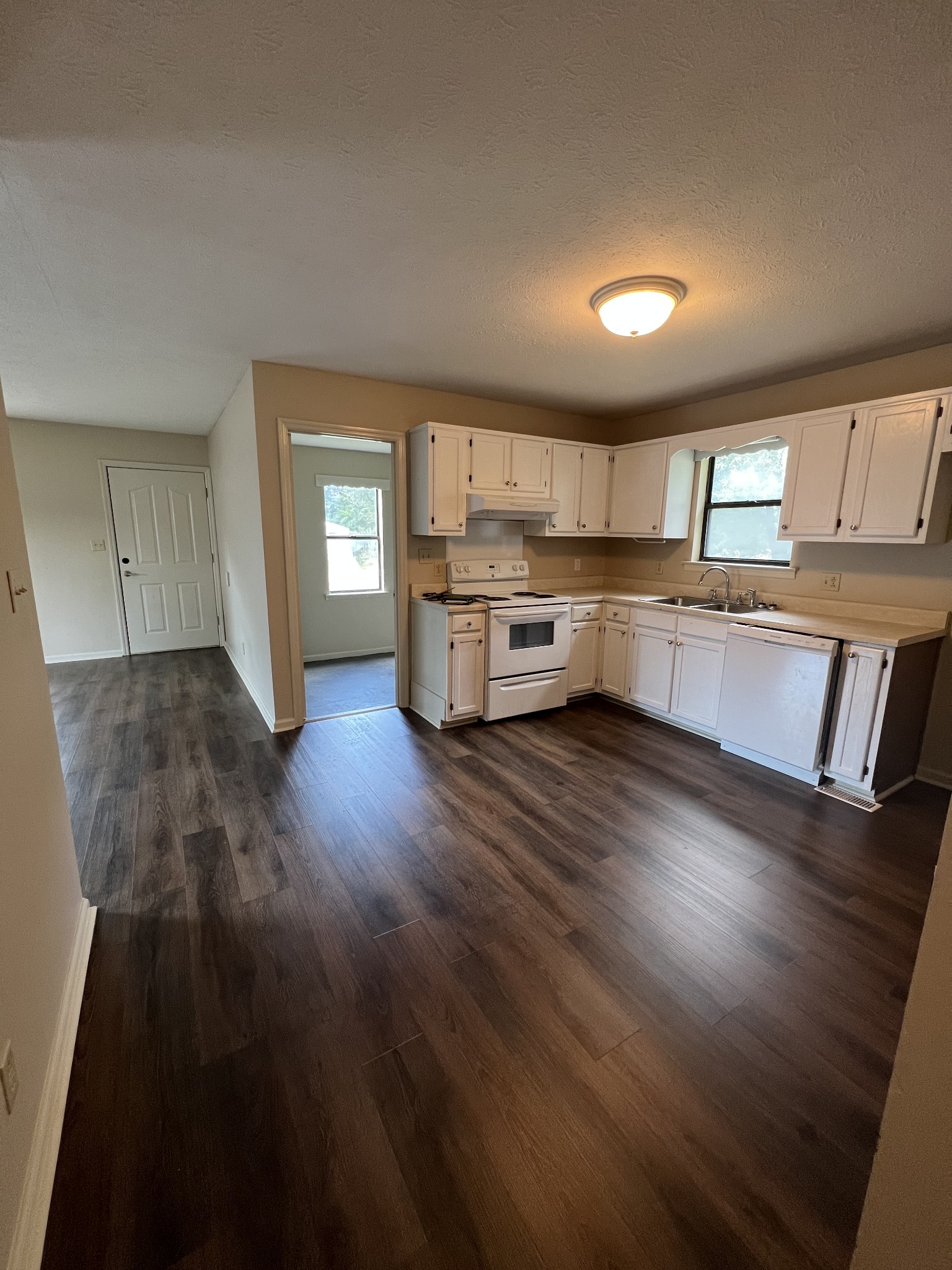 5012 Jacksboro Road Morrison, TN 37357 - Photo 6 of 13 a kitchen with granite countertop white cabinets and wooden floor