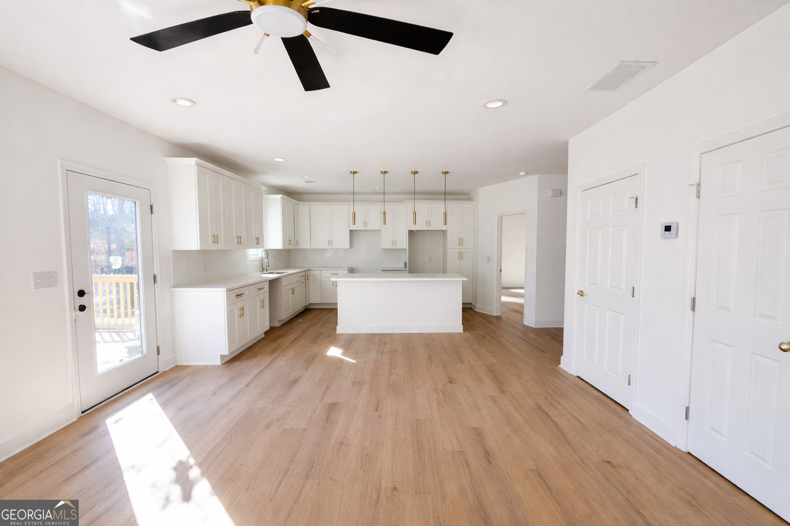 204 Custer Circle Griffin, GA 30223 - Photo 4 of 17 a view of a kitchen with wooden floor
