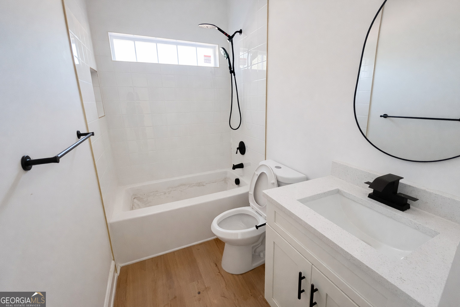 204 Custer Circle Griffin, GA 30223 - Photo 10 of 17 a bathroom with a sink a toilet and a mirror