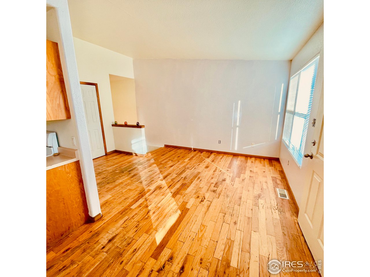 1317 Darrell Road Evans, CO 80620 - Photo 5 of 15 a view of a bedroom with wooden floor and entrance