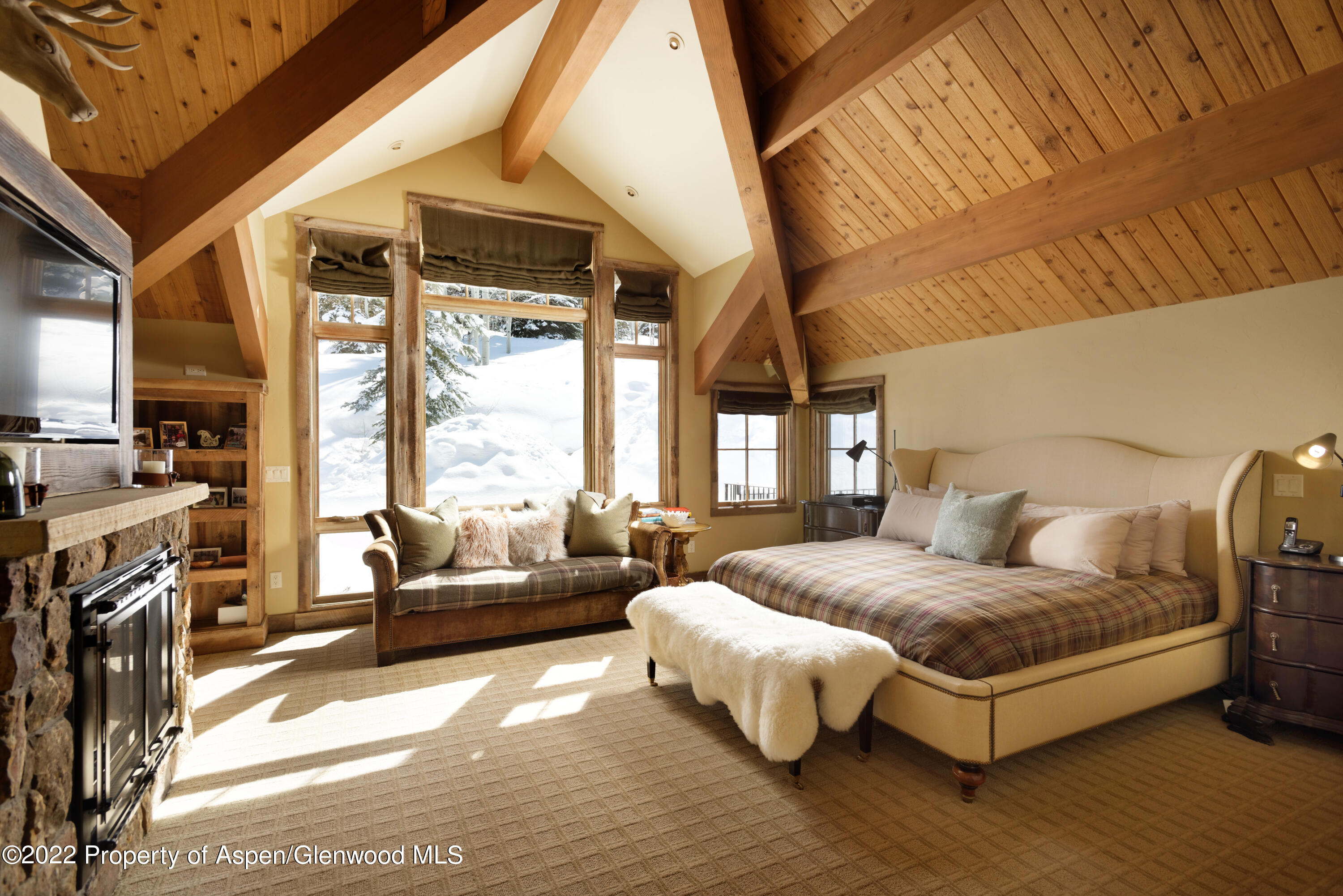 1400 Wood Road Snowmass Village, CO 81615 - Photo 13 of 36 a bedroom with a bed couch and a large window