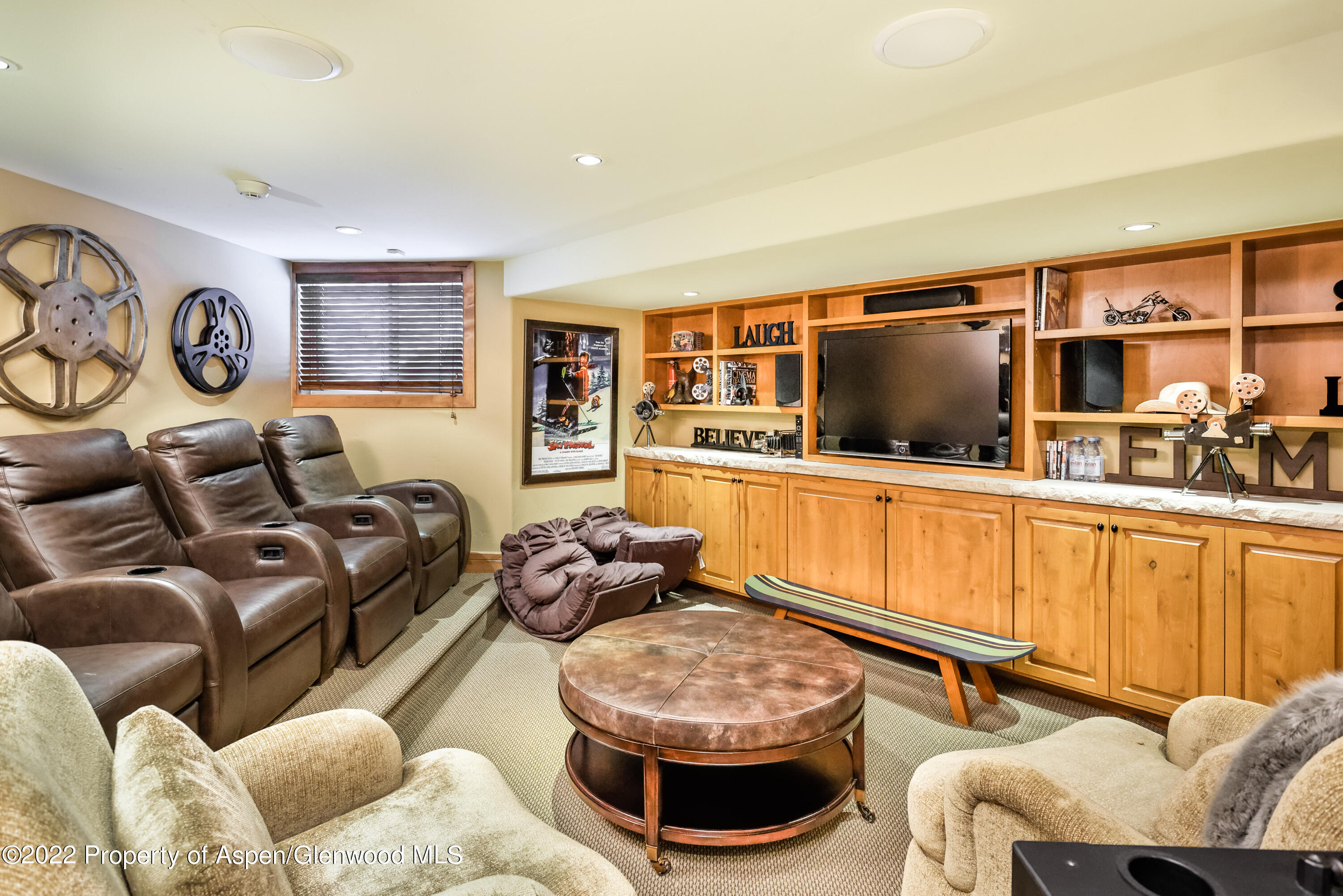 1400 Wood Road Snowmass Village, CO 81615 - Photo 21 of 36 a living room with furniture and a flat screen tv
