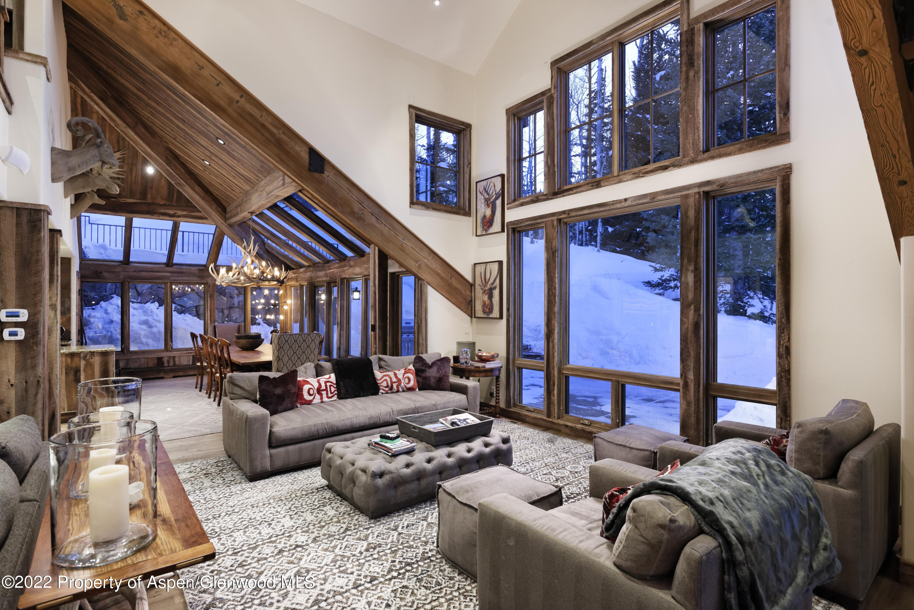 1400 Wood Road Snowmass Village, CO 81615 - Photo 25 of 36 a living room with furniture fireplace and a large window