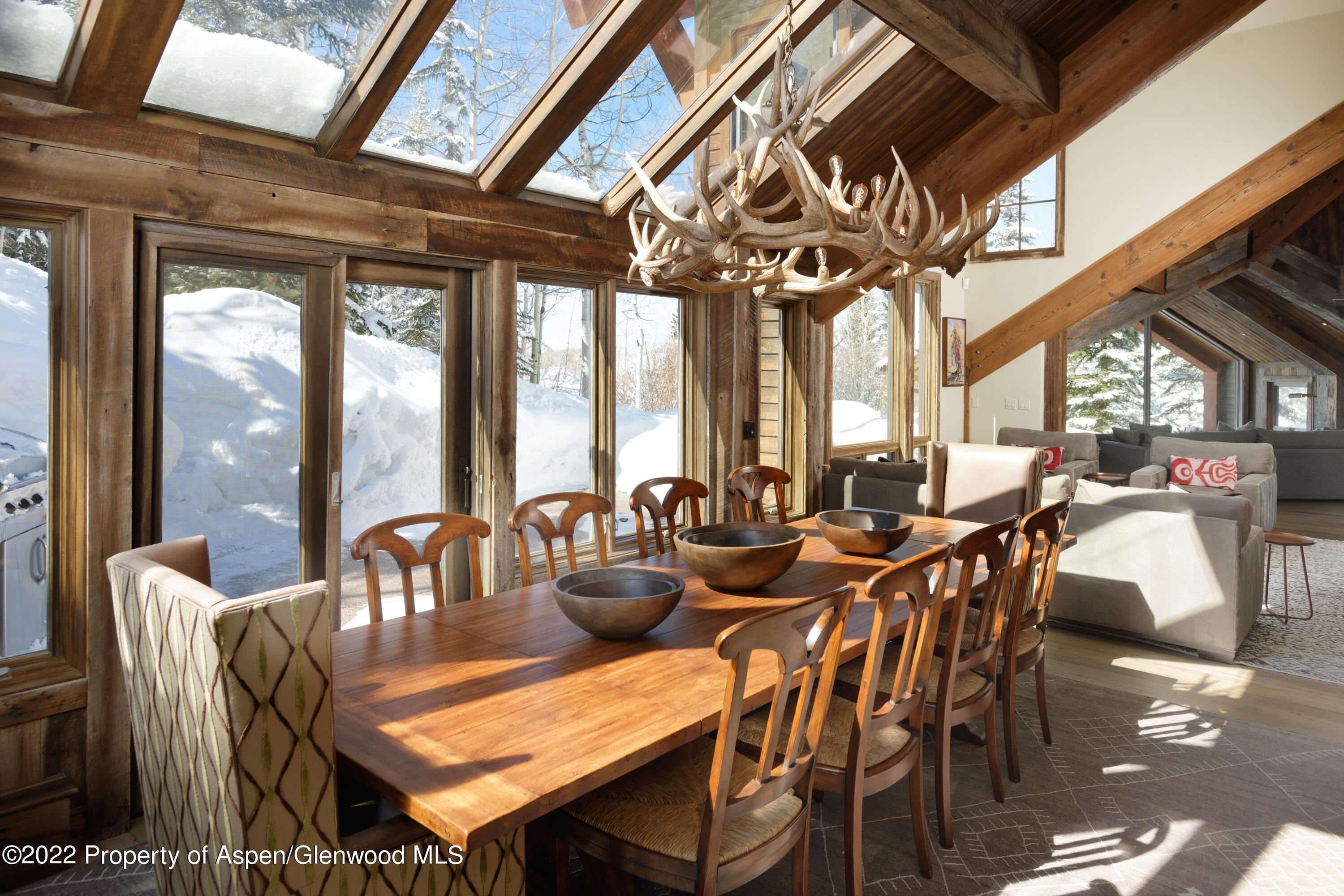 1400 Wood Road Snowmass Village, CO 81615 - Photo 9 of 36 a view of a dining room with furniture window and outside view