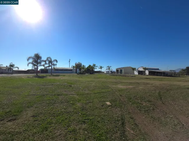 a view of a yard with swimming pool