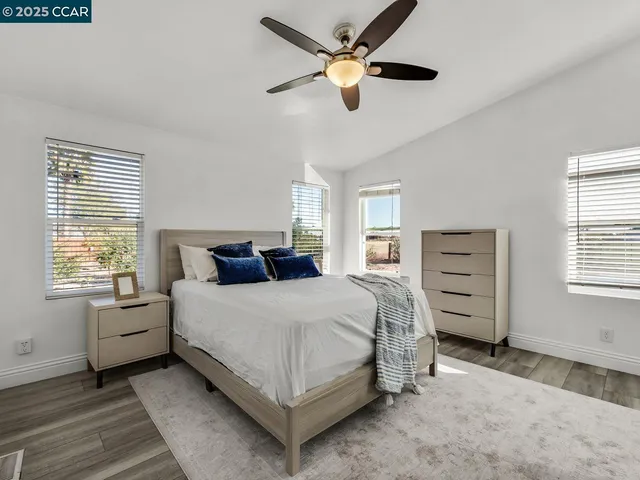 a workspace with furniture window and wooden floor