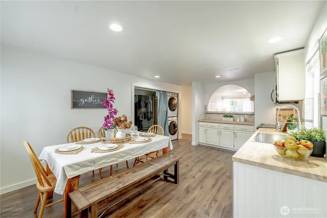 a kitchen with a dining table and chairs
