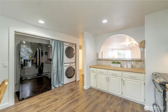 a kitchen with a refrigerator and a sink
