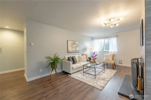a living room with furniture and a table