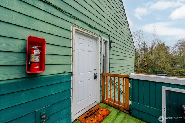 a view of a wooden door and a bench