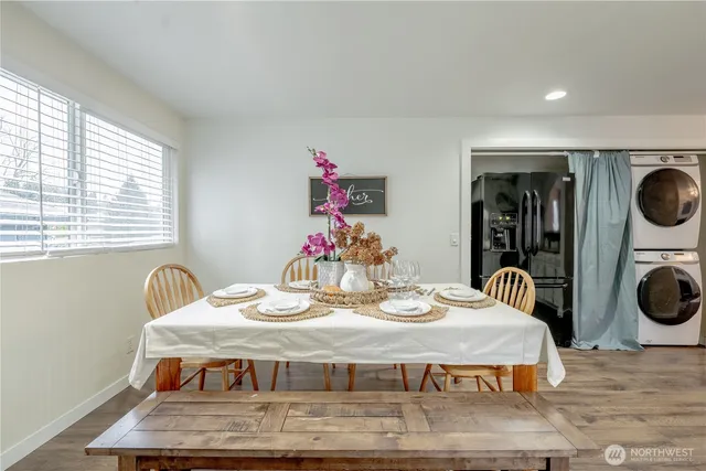 a dining room with furniture and window