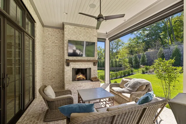a outdoor living space with furniture and a fireplace