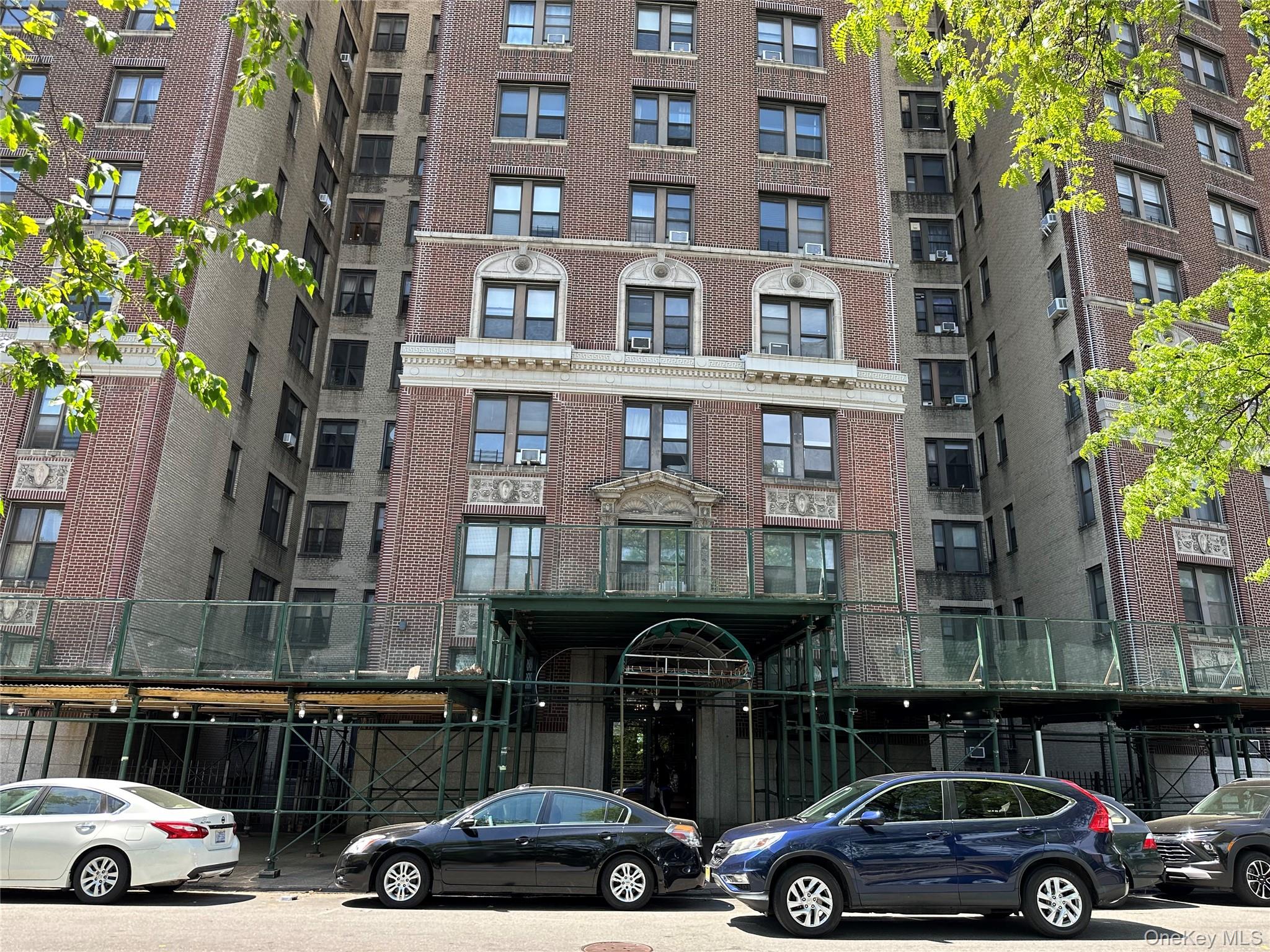 409 Edgecombe Avenue, Unit 7F Manhattan, NY 10032 - Photo 19 of 22 a couple of cars parked in front of a building