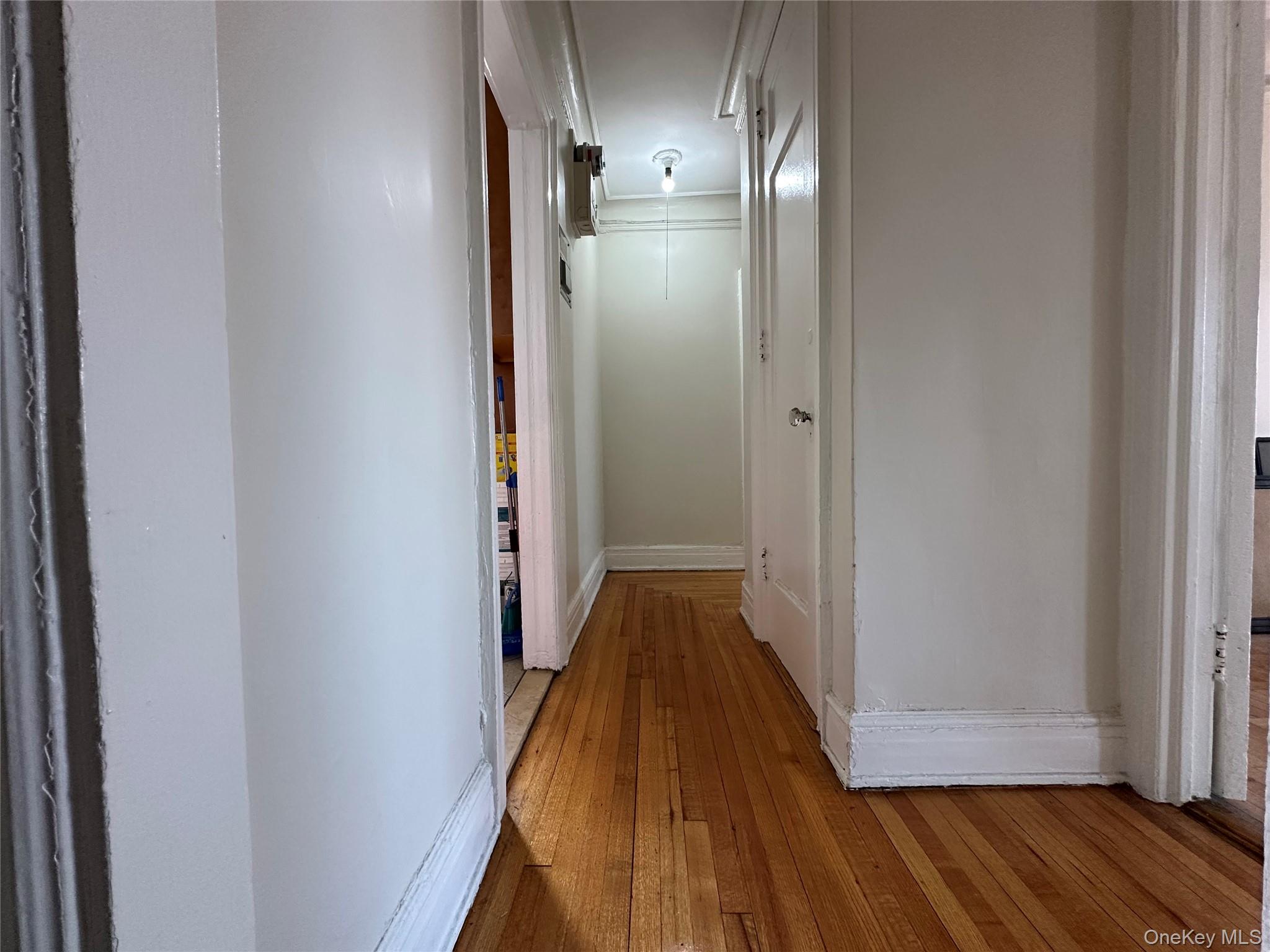 409 Edgecombe Avenue, Unit 7F Manhattan, NY 10032 - Photo 10 of 22 a view of a hallway with wooden floor