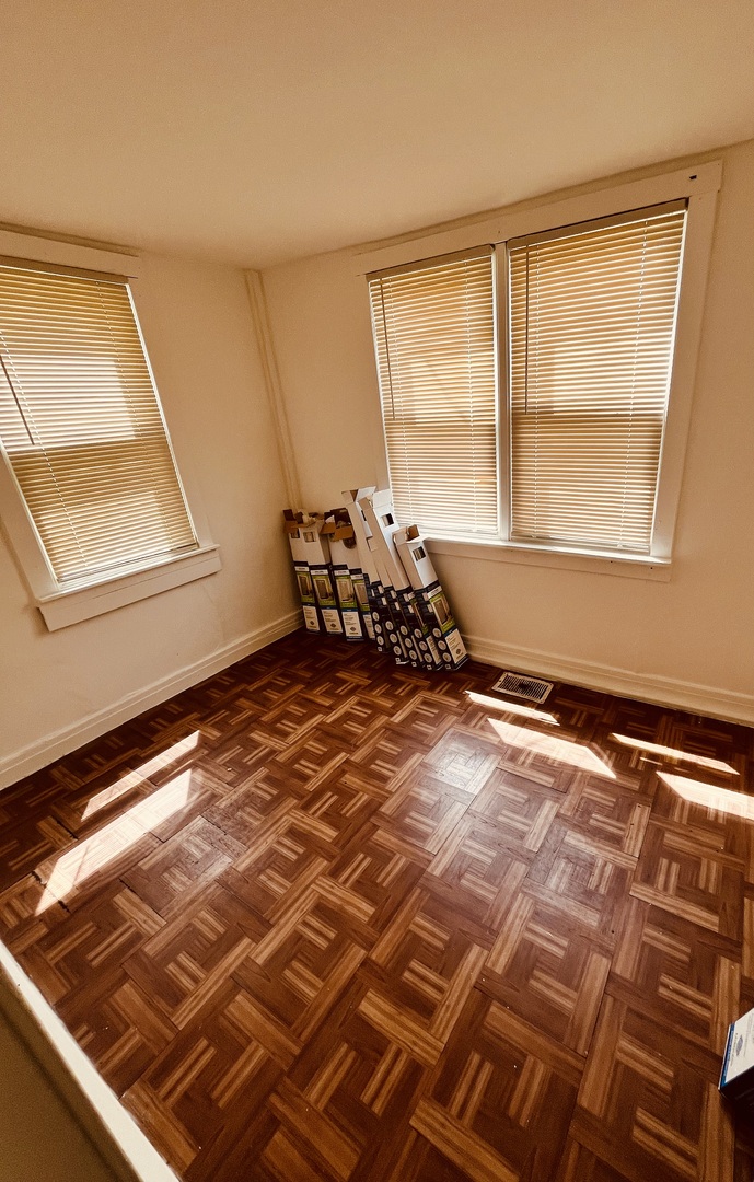 8236 South Sangamon Street, Unit 1 Chicago, IL 60620 - Photo 6 of 12 a bedroom with a bed and a window