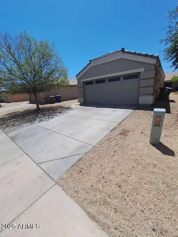 a front view of a house with a garage