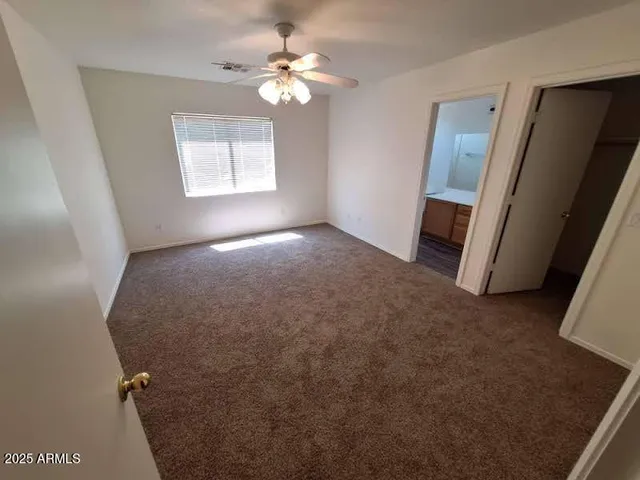 a view of empty room with windows