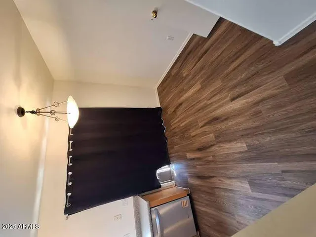 a view of staircase with wooden floor
