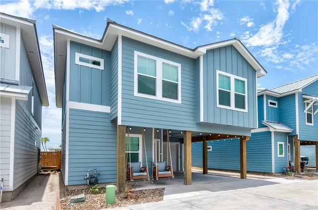 a front view of a house with a garage