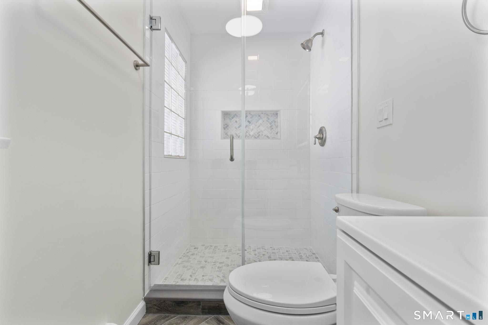 122 Lakeside Drive Ridgefield, CT 06877 - Photo 14 of 29 a bathroom with a toilet a sink and shower