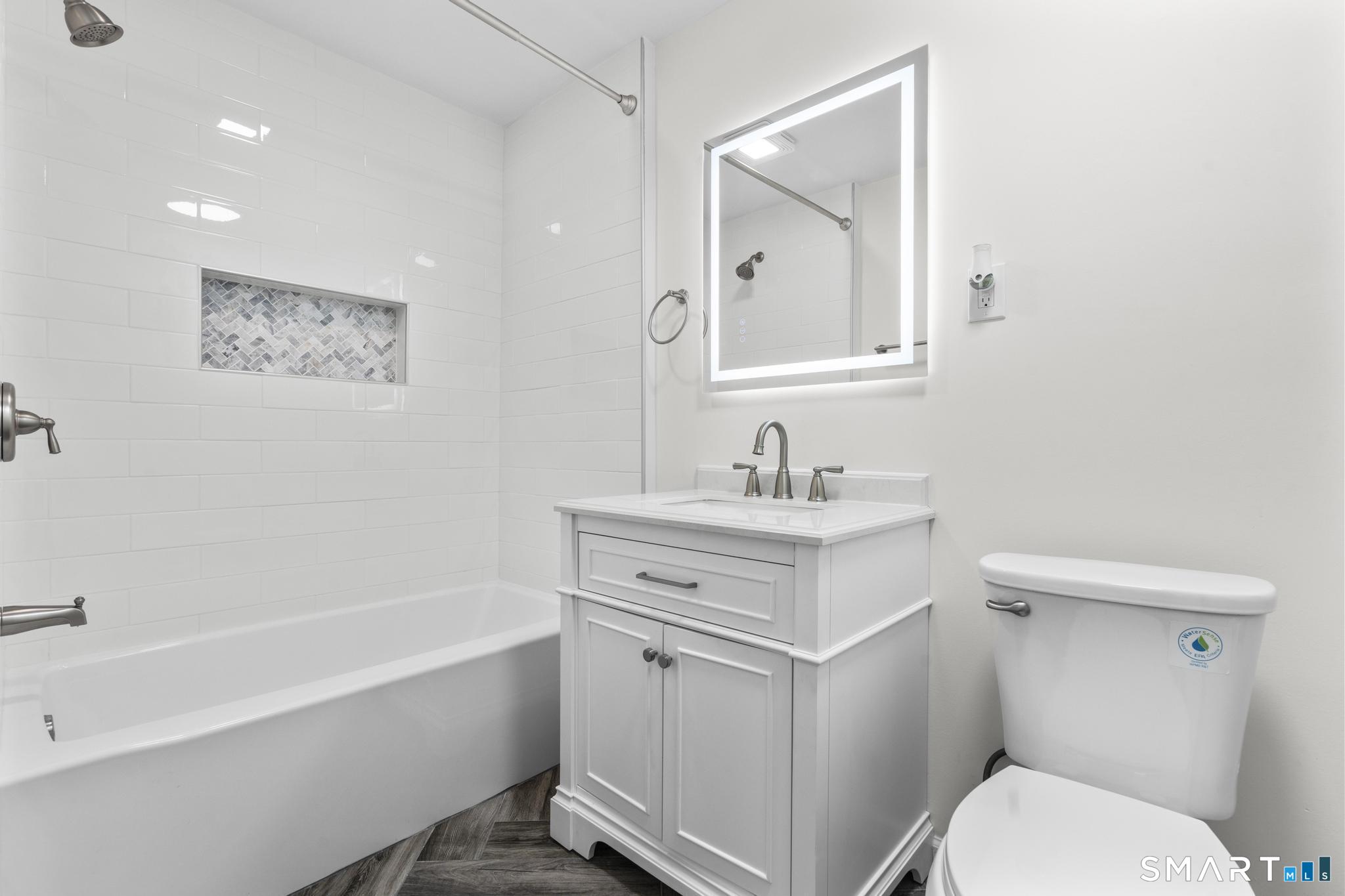 122 Lakeside Drive Ridgefield, CT 06877 - Photo 17 of 29 a bathroom with a sink toilet vanity and bathtub