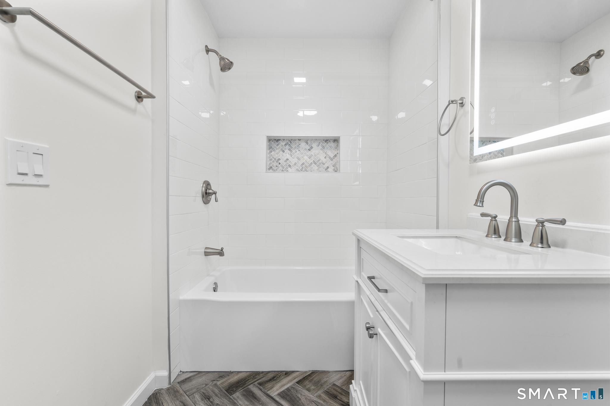 122 Lakeside Drive Ridgefield, CT 06877 - Photo 18 of 29 a bathroom with a bathtub and a sink