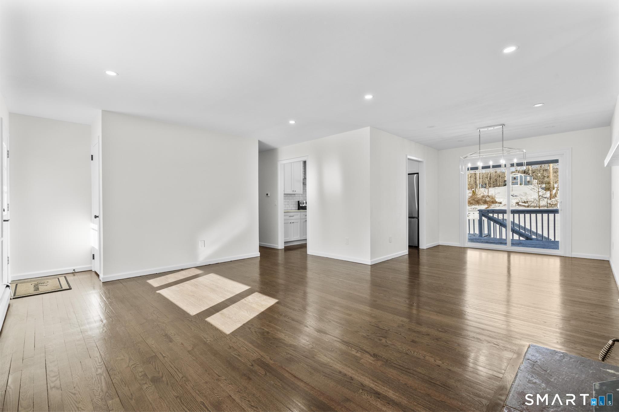 122 Lakeside Drive Ridgefield, CT 06877 - Photo 5 of 29 a view of a livingroom with wooden floor