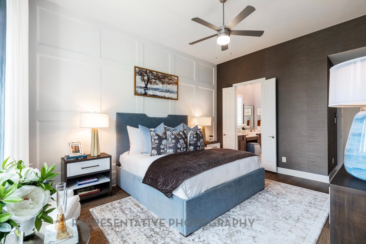 22227 Mount Whitney Road Waller, TX 77484 - Photo 20 of 49 a bedroom with a bed a couch and a potted plant