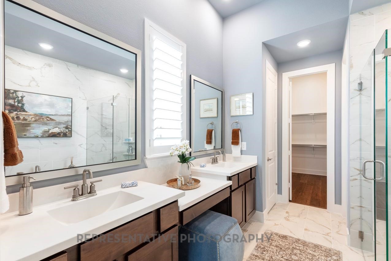 22227 Mount Whitney Road Waller, TX 77484 - Photo 25 of 49 a bathroom with a sink double vanity and a mirror
