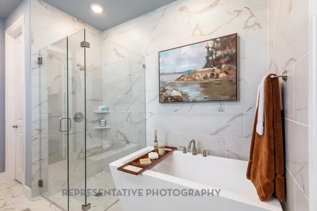 a bathroom with a tub sink and mirror