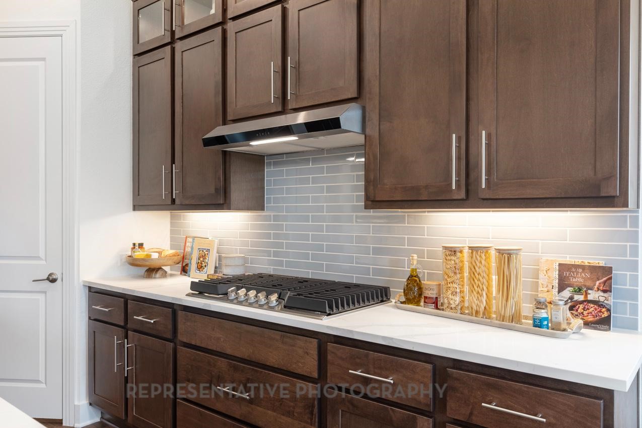 22227 Mount Whitney Road Waller, TX 77484 - Photo 7 of 49 a kitchen with a sink cabinets and appliances
