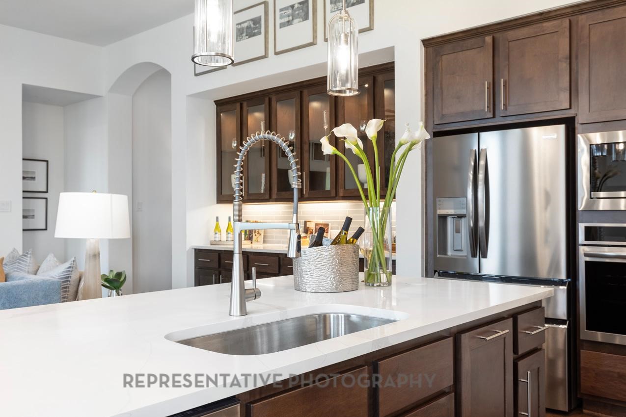 22227 Mount Whitney Road Waller, TX 77484 - Photo 10 of 49 a kitchen with stainless steel appliances a sink and a refrigerator