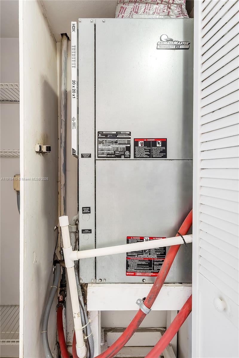 2025 Northeast 164th Street, Unit 907 North Miami Beach, FL 33162 - Photo 19 of 33 a utility room with dryer and washer