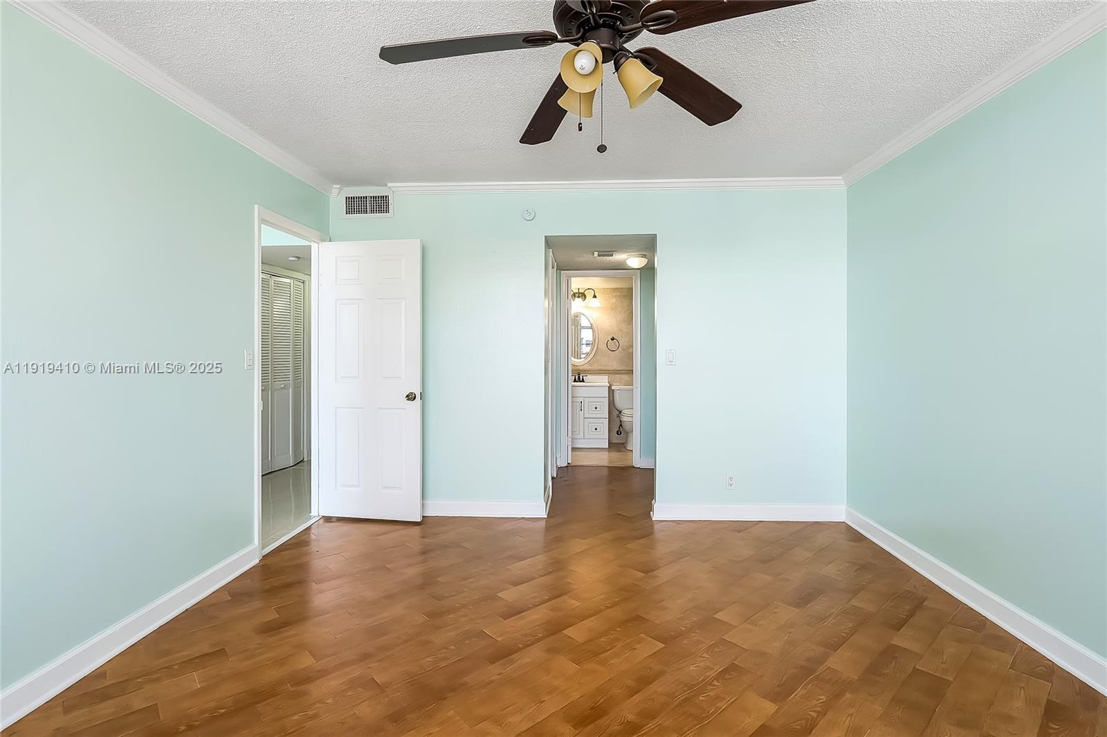 2025 Northeast 164th Street, Unit 907 North Miami Beach, FL 33162 - Photo 21 of 33 an empty room with closet and chandelier fan