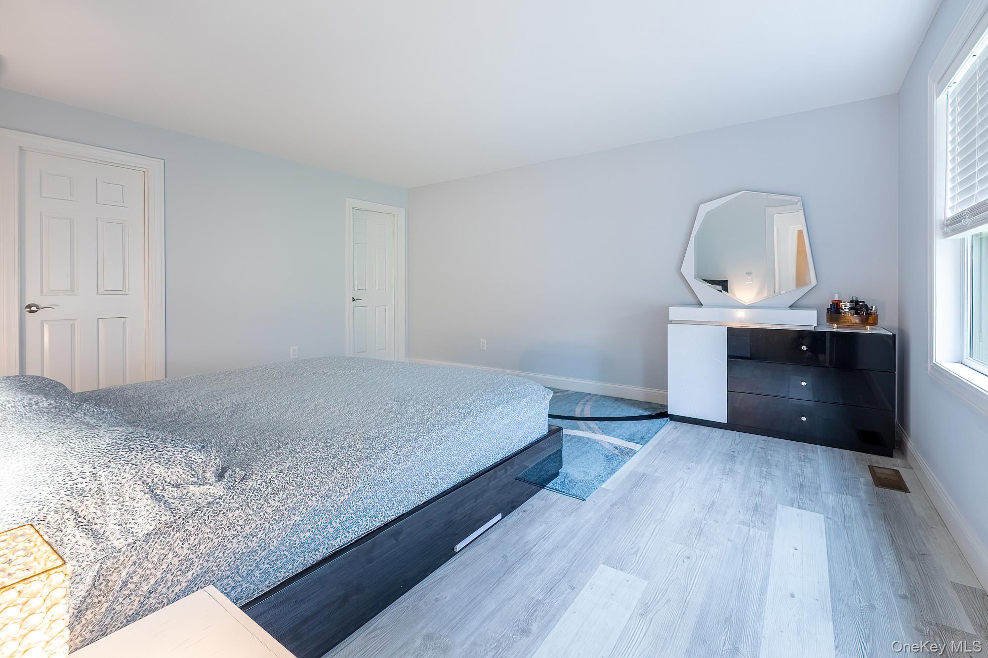 5 Teramar Way White Plains, NY 10607 - Photo 13 of 39 a bedroom with a bed and a dresser