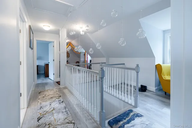 a view of a hallway view with staircase