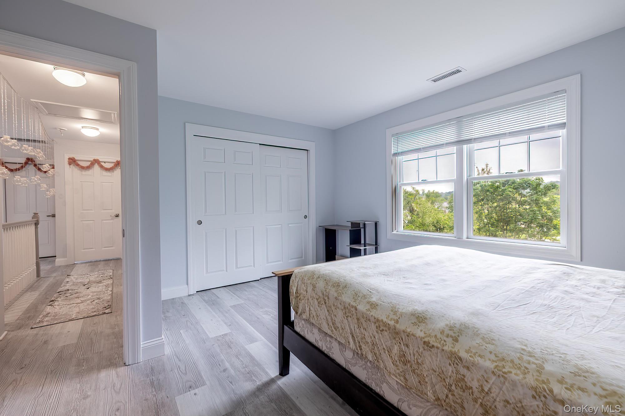 5 Teramar Way White Plains, NY 10607 - Photo 20 of 39 a bedroom with a bed and a large window