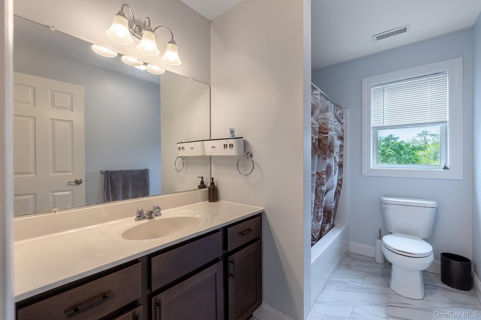 5 Teramar Way White Plains, NY 10607 - Photo 21 of 39 a bathroom with a toilet a sink and a mirror