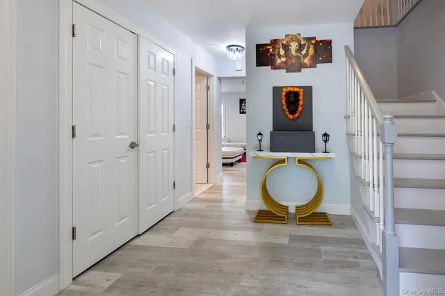 a bathroom with a granite countertop toilet and a sink