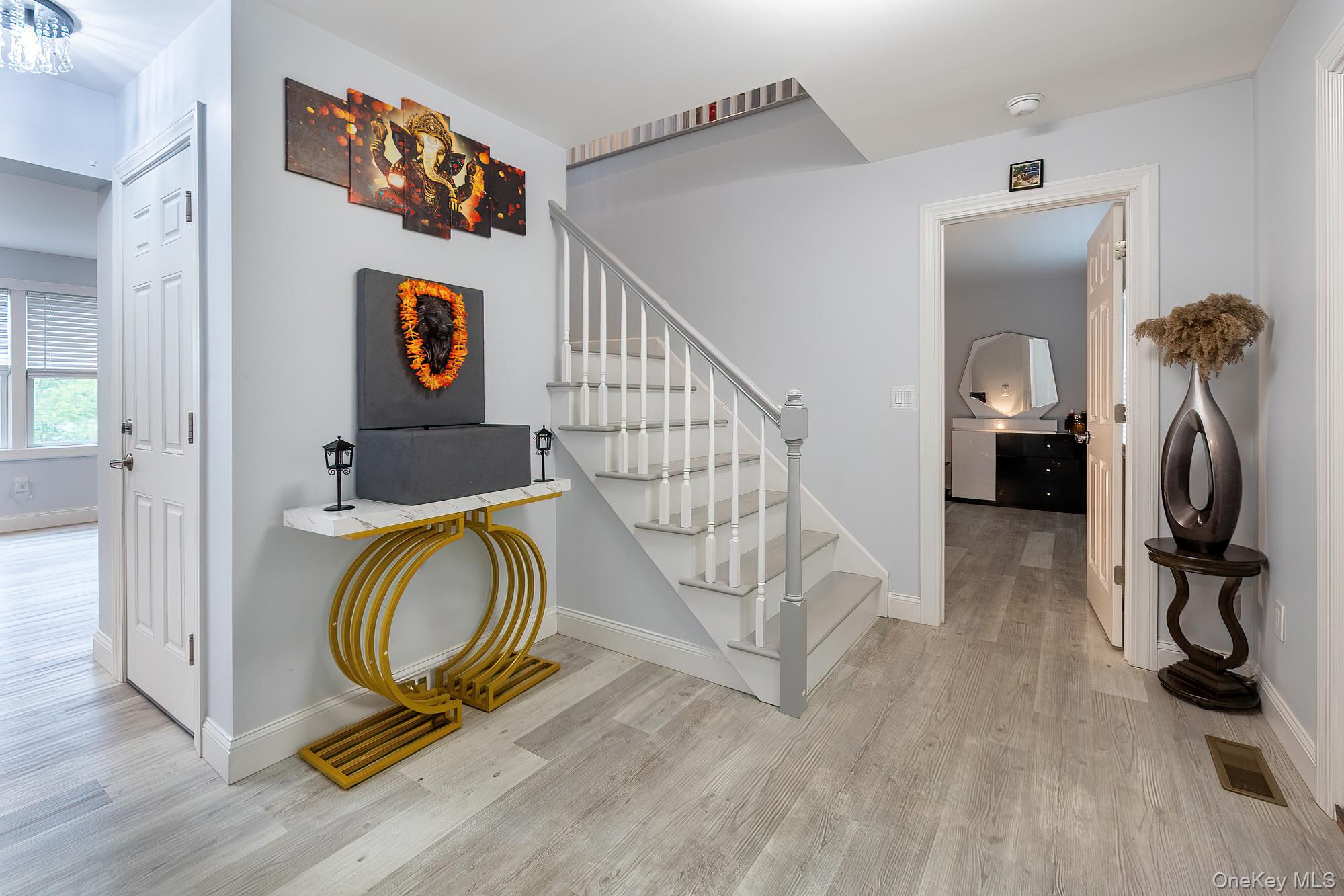 5 Teramar Way White Plains, NY 10607 - Photo 4 of 39 a view of a room with wooden floor and furniture
