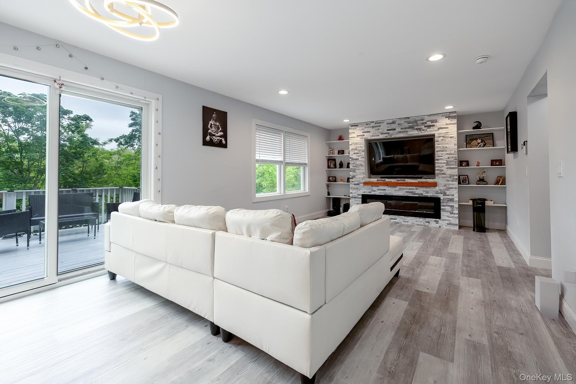 5 Teramar Way White Plains, NY 10607 - Photo 9 of 39 a living room with furniture and a flat screen tv