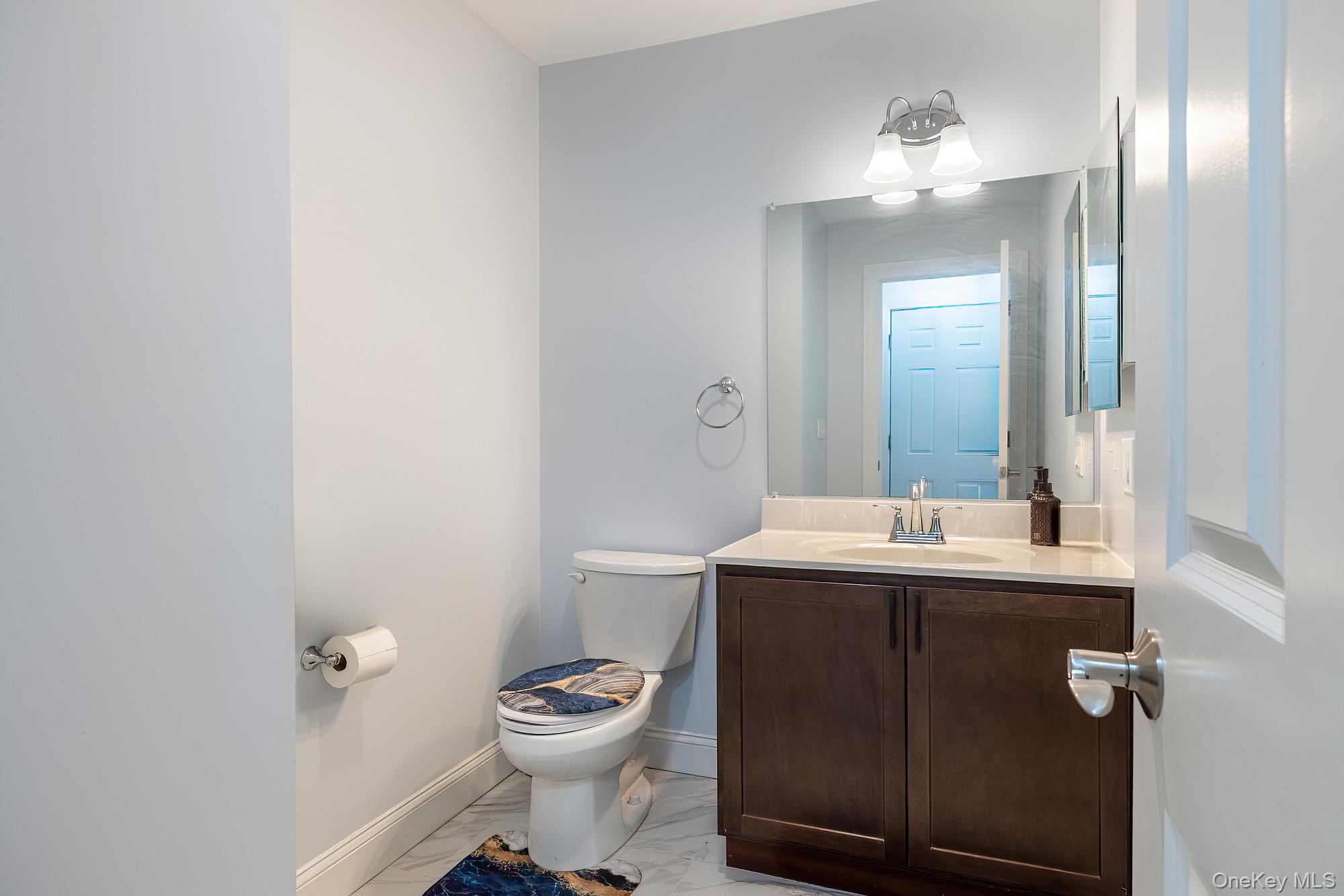 5 Teramar Way White Plains, NY 10607 - Photo 10 of 39 a bathroom with a toilet a sink and mirror